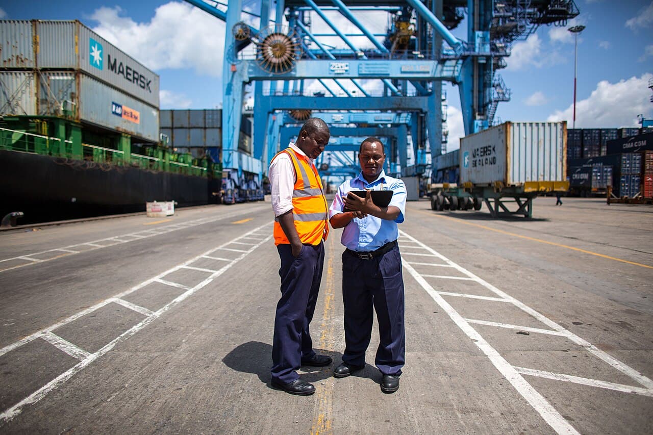 Two officials checking cargo records at the Port of Mombasa